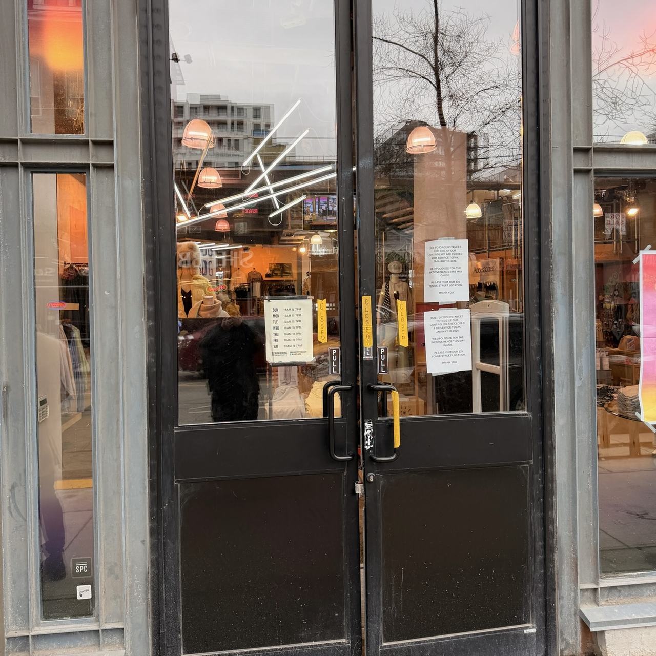 Commercial double storefront doors inspected during emergency break-in repair