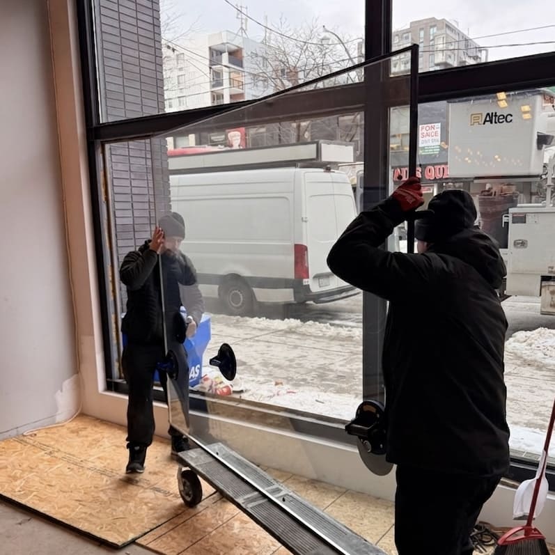 New commercial glass prepared for installation after broken unit removal