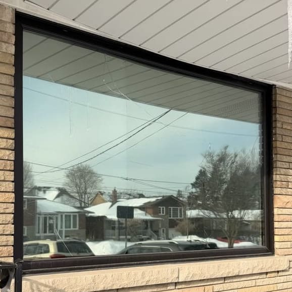 Broken residential glass before replacement