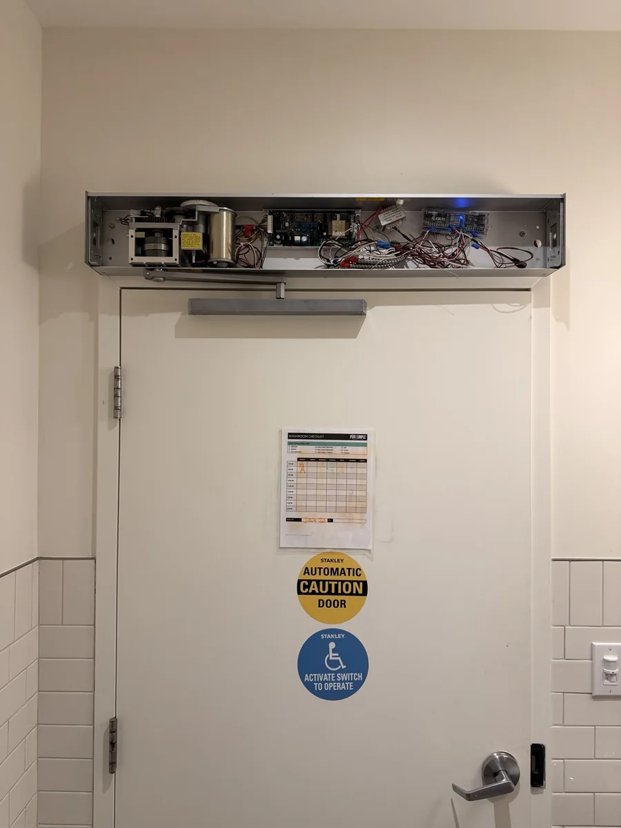 Automatic door operator cover removed for diagnosis of the motor, control board and wiring