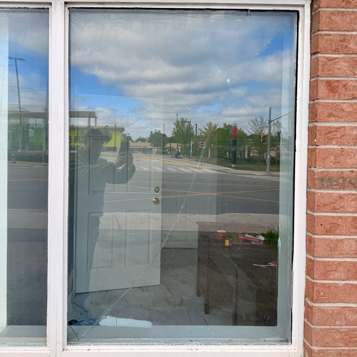 Cracked residential insulated glass unit before emergency window replacement