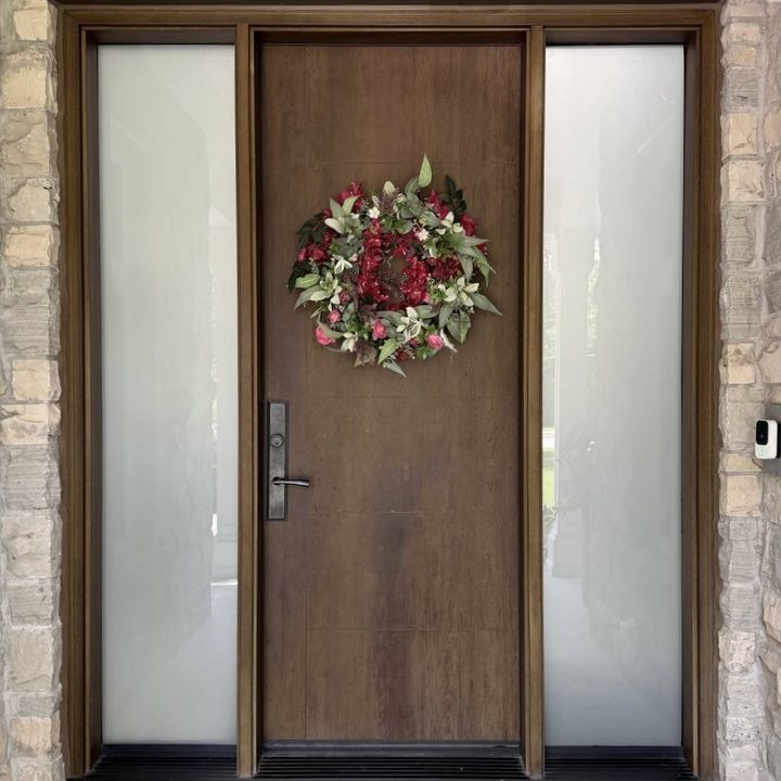 Wood entry door with two full-height frosted glass sidelites