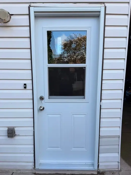 New insulated steel front entry door installed in Milton with tighter weather sealing
