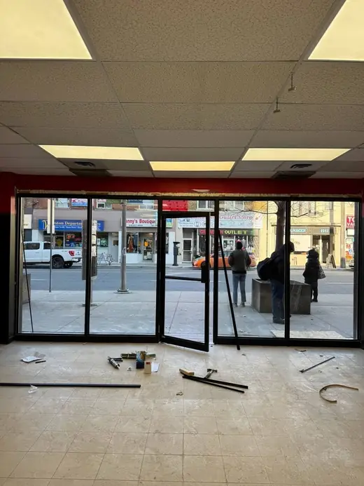 Brampton plaza storefront rebuilt with new aluminum door and clear storefront glass