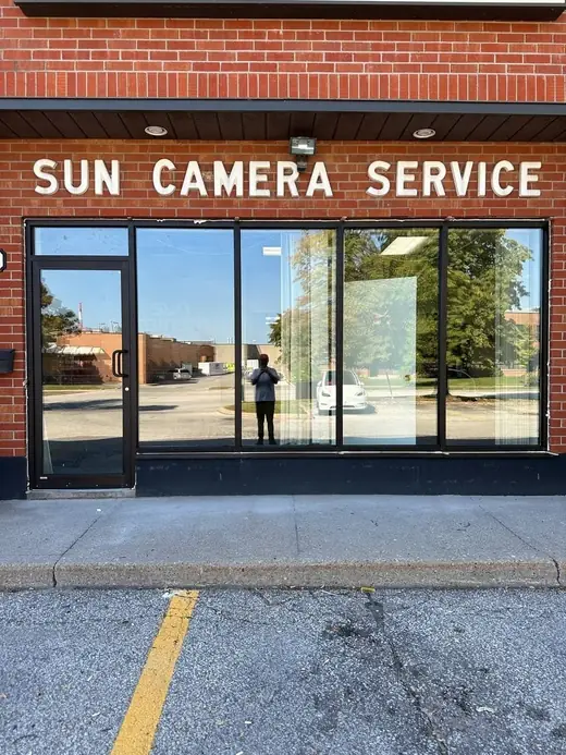 Sun Camera storefront rebuilt in North York with new glass door and storefront glass