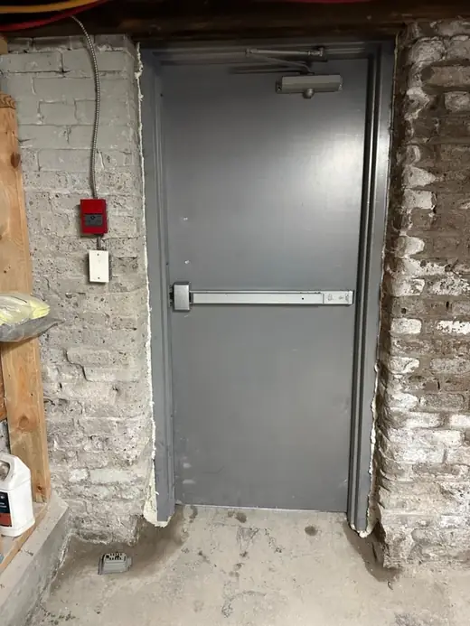 After metal door replacement with panic bar and door closer near Lauder Ave and St Clair Ave W in Toronto