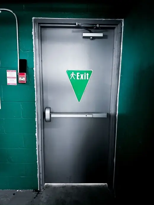 After metal emergency exit door replacement with panic bar and door closer on Black Creek Dr in Toronto