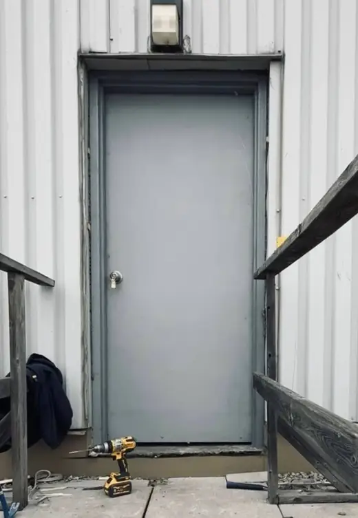 Exterior metal security door replaced in Richmond Hill with stronger fit and hardware