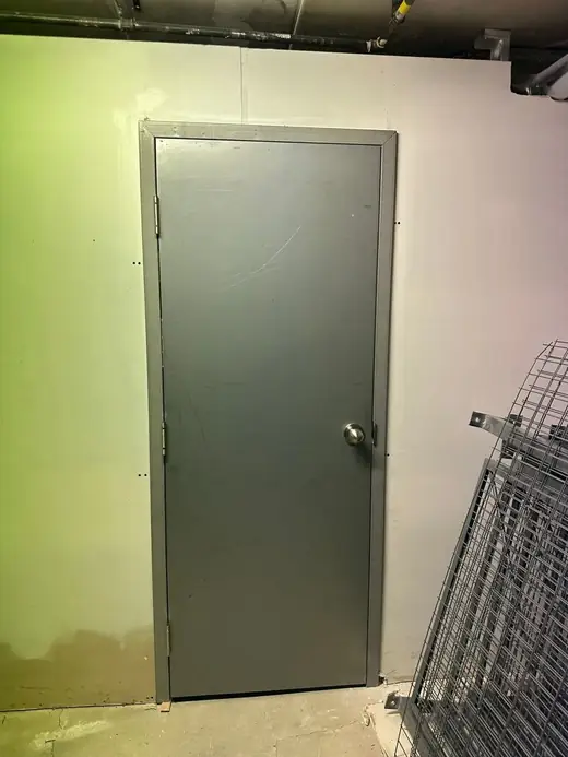 Steel storage room door installed in a North York commercial space with secure hardware