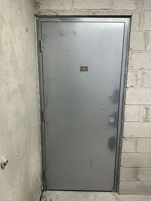Replacement metal basement service door installed in Toronto