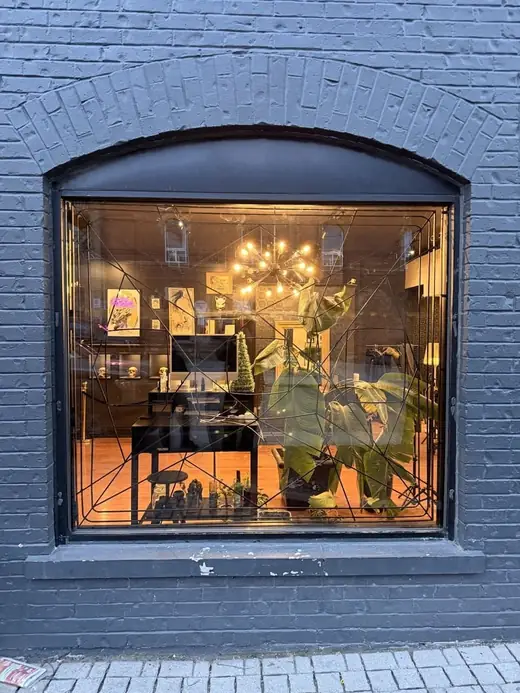 Replacement storefront glass installed at a Parkdale tattoo studio on Queen Street West