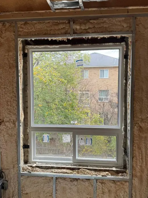 New vinyl window installed in a rebuilt Mississauga renovation opening with insulated perimeter fit