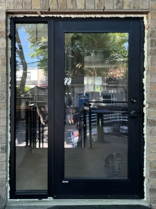 Black hinged garden door with full-height sidelight installed in Newmarket