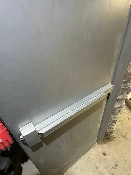 Push bar installed on a Brock Township metal exit door for safer commercial egress