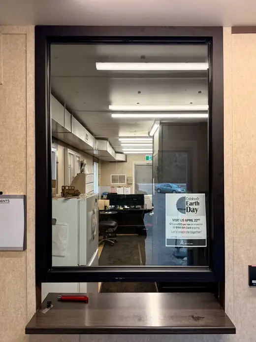 Armored glass replaced in a Cedar Valley service window opening.