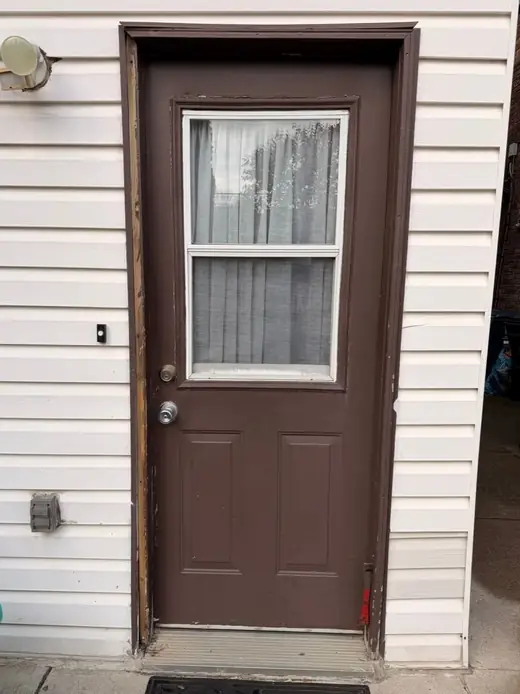 Drafty old front door in Milton before insulated steel entry replacement