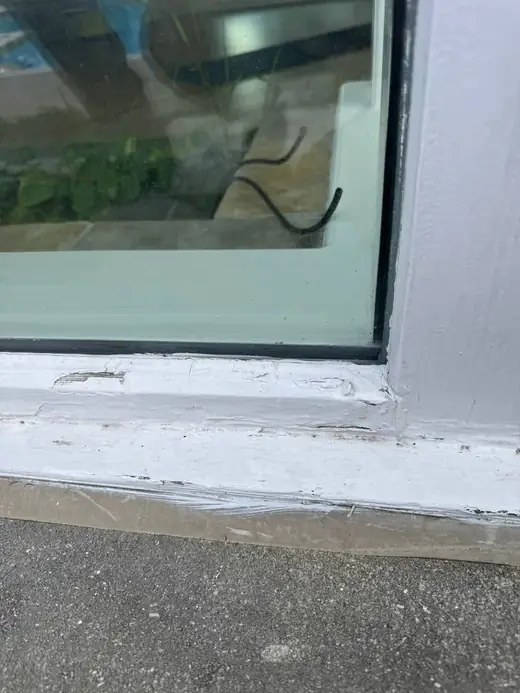 Failed exterior caulking around a leaking corner window in Oakville.