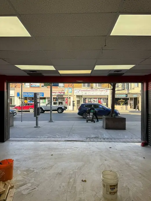 Worn Brampton plaza storefront before new aluminum store door and glass replacement