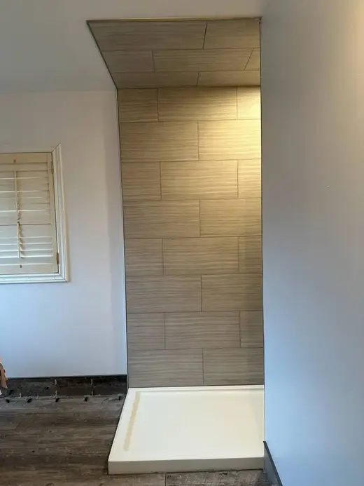 Finished Milton shower tile and bench before custom frameless glass measurement and installation