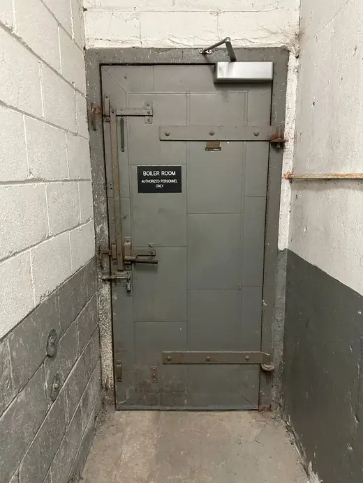 Old boiler room fire-rated door in Newtonbrook before replacement