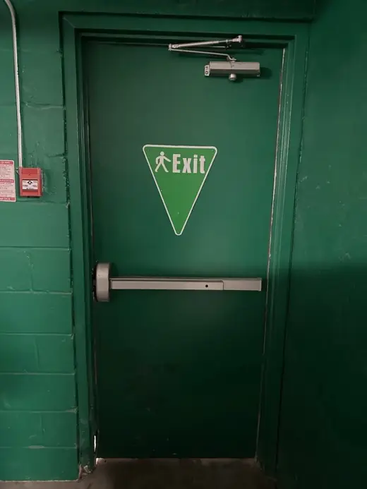 Before metal emergency exit door replacement on Black Creek Dr near North Keelesdale Park in Toronto