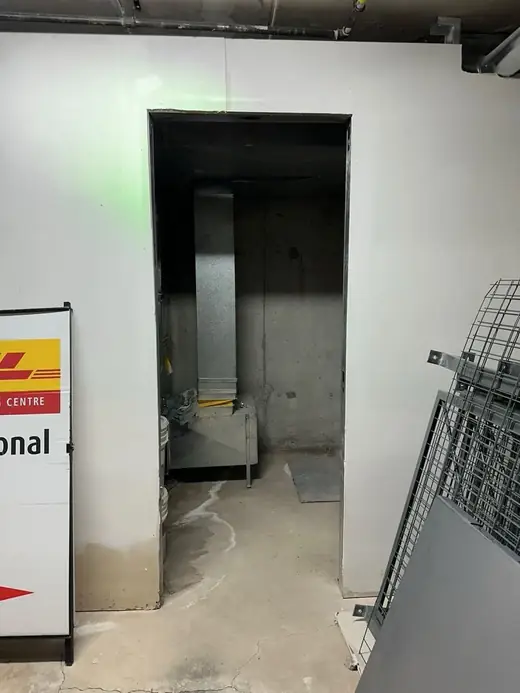 North York commercial storage room opening before new steel door installation
