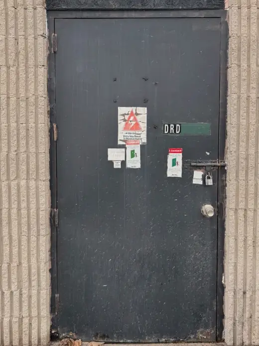 Old commercial steel entry door and unsealed perimeter in Richmond Hill before replacement