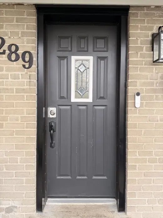 Old Oakville glass front door before replacement with a solid privacy entry door