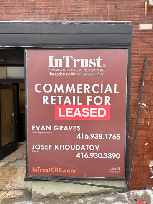 Georgina retail front window before clear storefront glass replacement