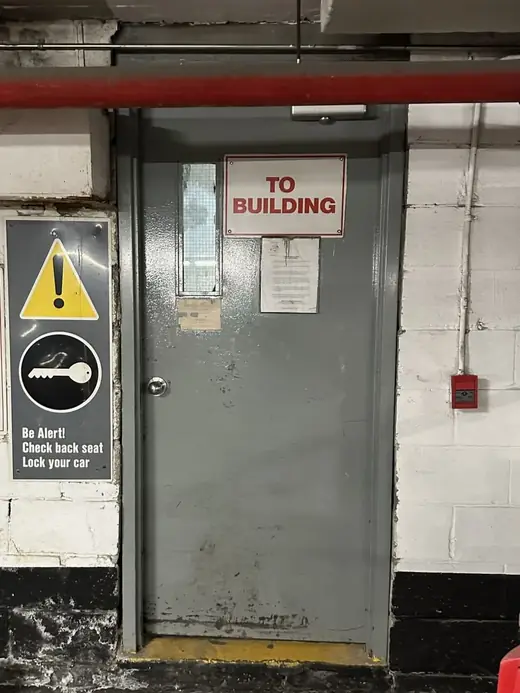Old fire-rated metal door in Halton Hills before replacement with a new steel door and GPW vision lite