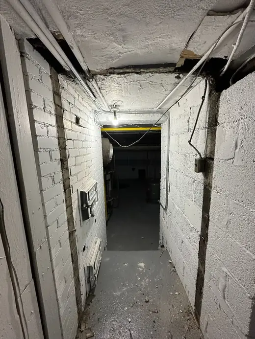 Burlington basement service opening before fire-rated steel door installation