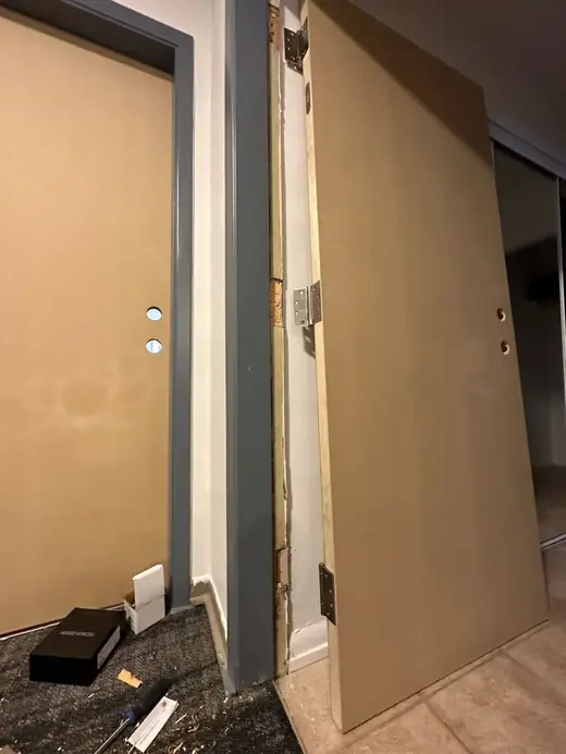 Worn Vaughan office room door before corridor door replacement