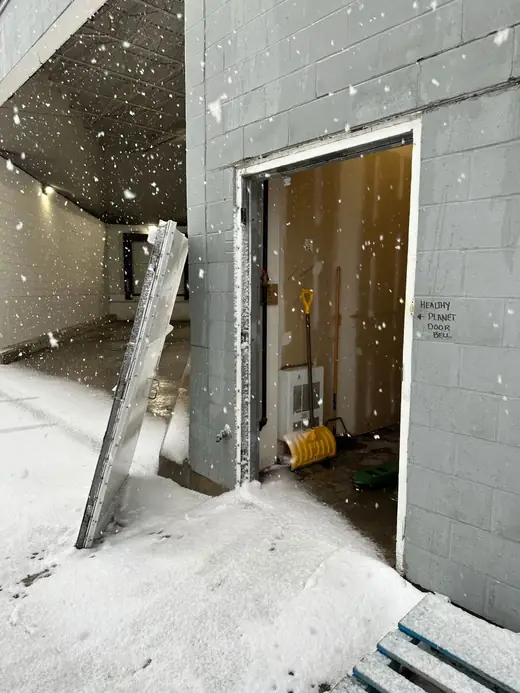 Healthy Planet rear entrance in Vaughan with the commercial door displaced after a break-in