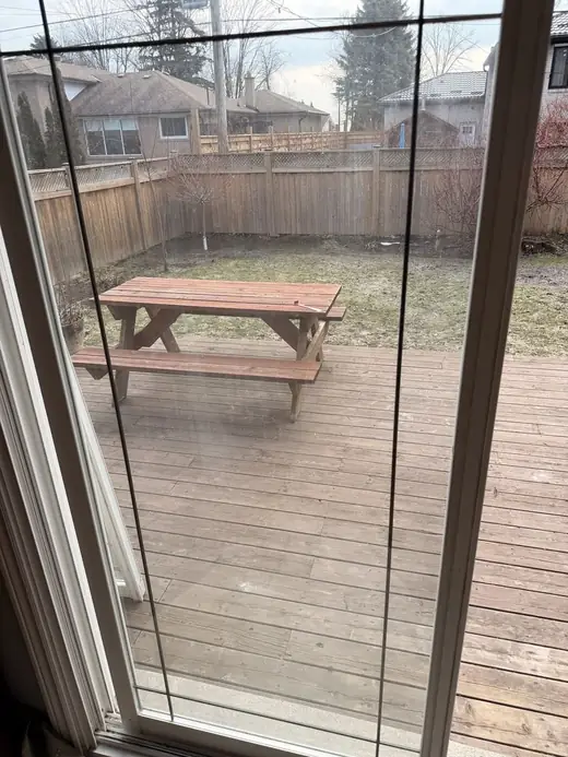 Foggy Aurora patio door glass before sealed unit replacement in the existing frame