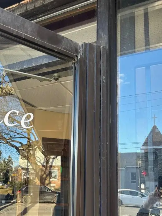 Before: Emergency Door Repair at Occasions Pub, Eastwood Rd Toronto - Toronto