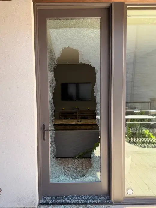 Shattered balcony door glass in Georgina before emergency securing