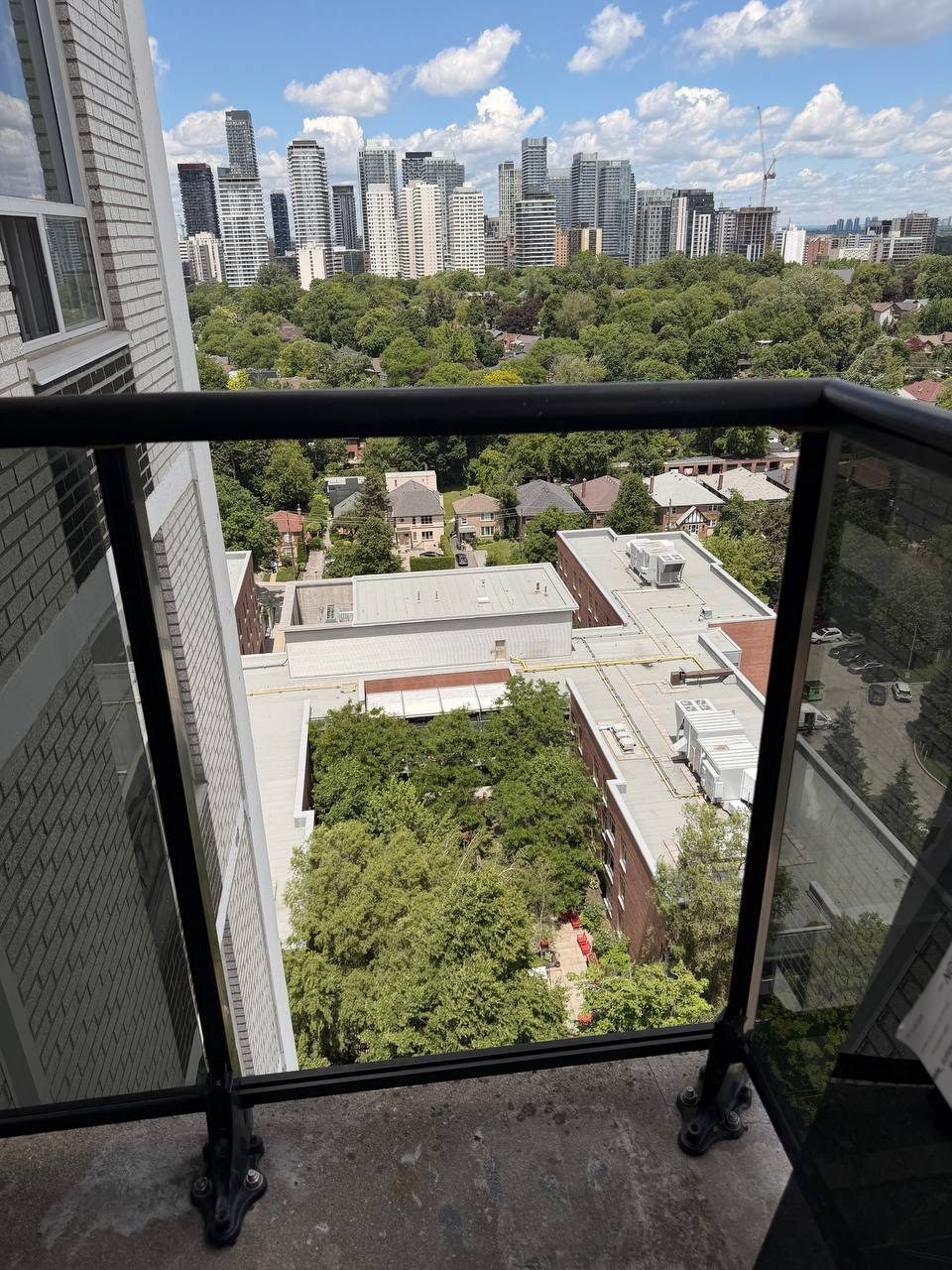 Toronto condo balcony glass panel on Davisville Ave before replacement