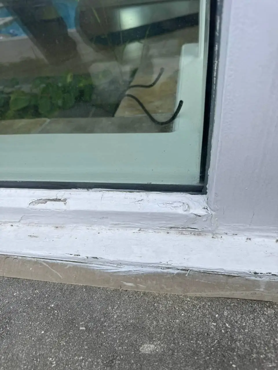 Failed exterior caulking around a leaking corner window in Oakville.