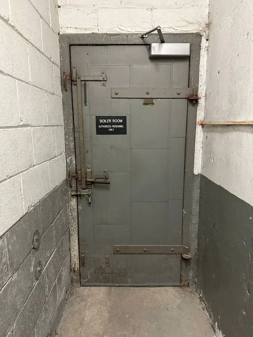 Old boiler room fire-rated door in Newtonbrook before replacement