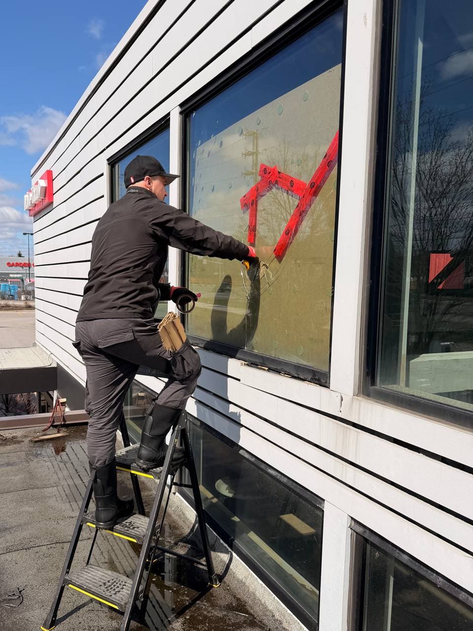 Damaged large commercial restaurant window in Ajax before replacement
