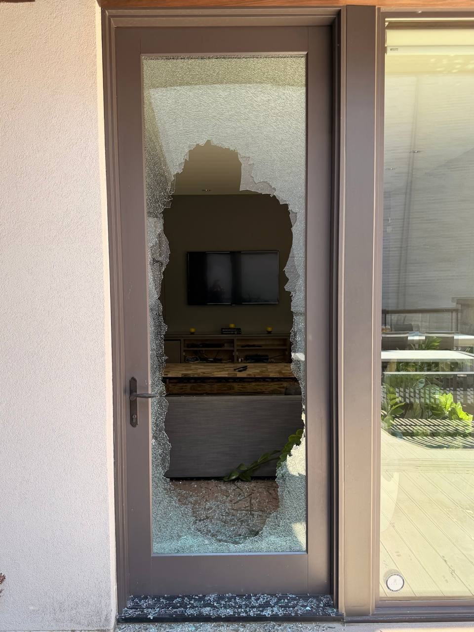 Shattered balcony door glass in Georgina before emergency securing