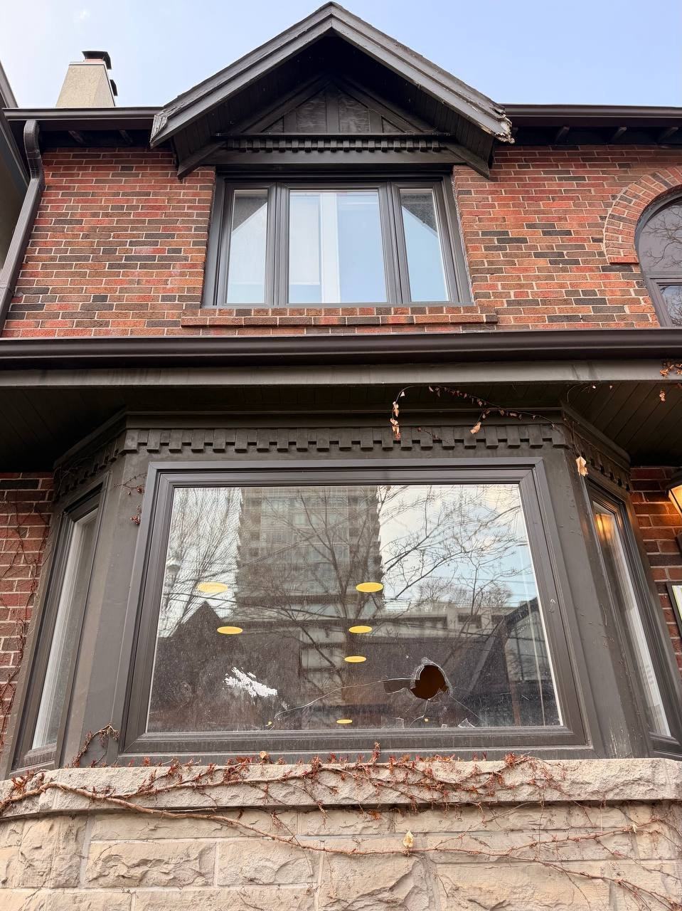 Broken front bay window glass on a Whitby home before replacement