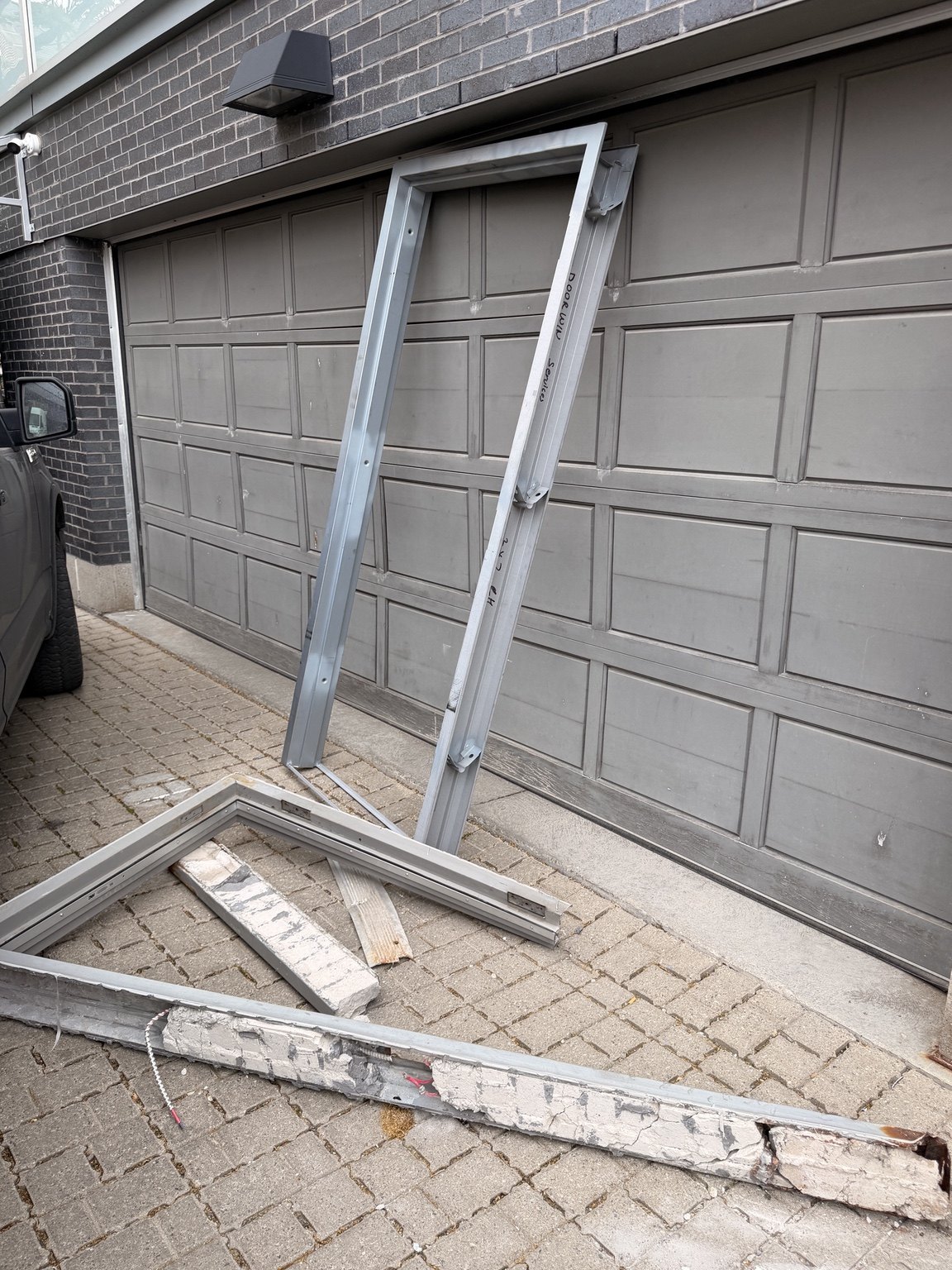 Old commercial door frame removed before new entrance installation