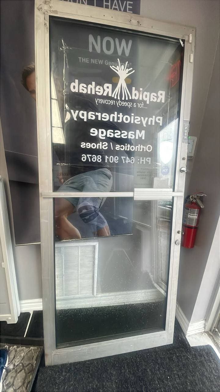 Foggy commercial entrance door glass in Mississauga before replacement
