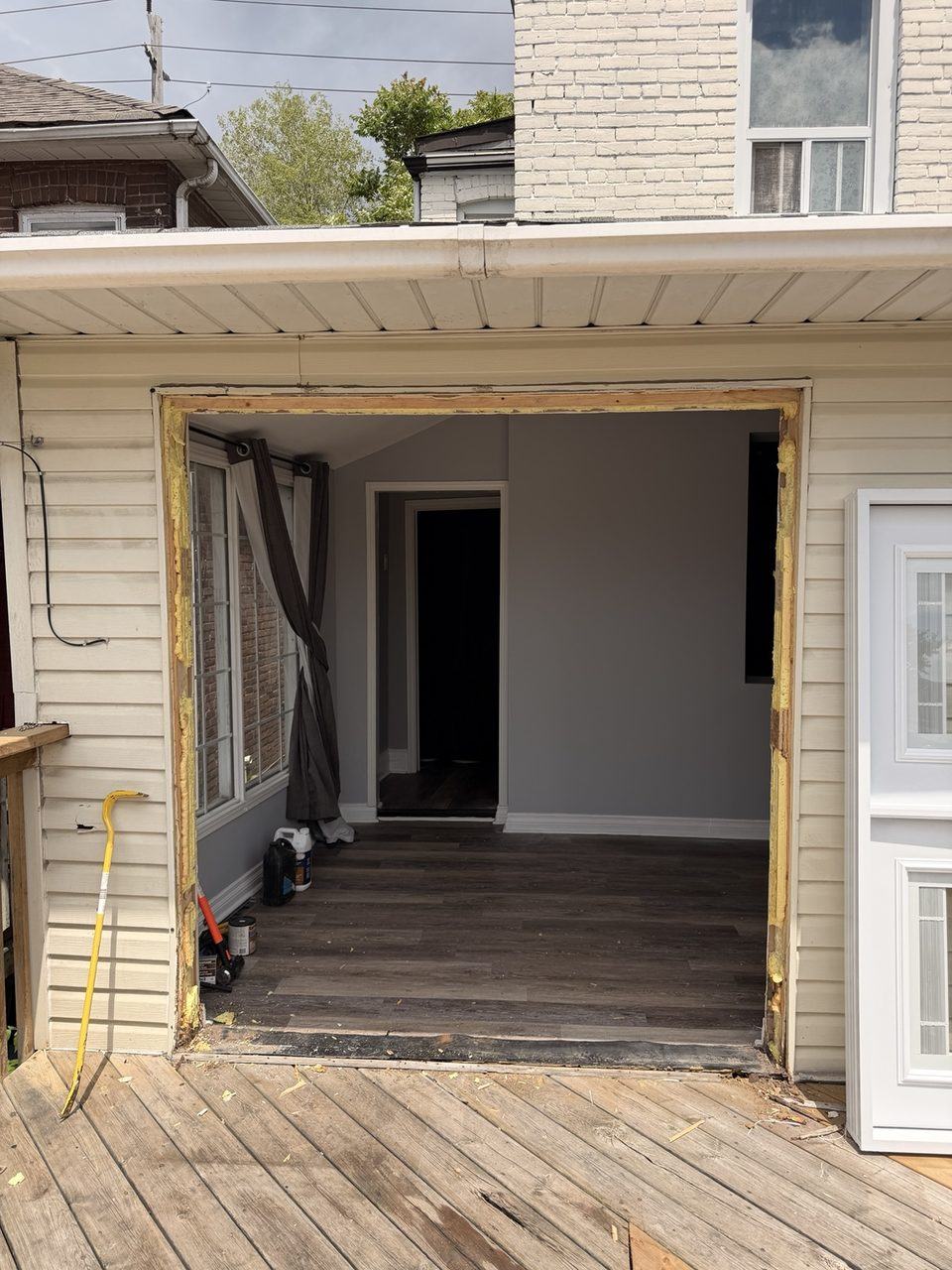 French patio doors removed and rough opening cleared for new door frame installation