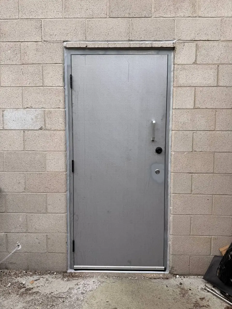 New metal rear service door installed in Pickering