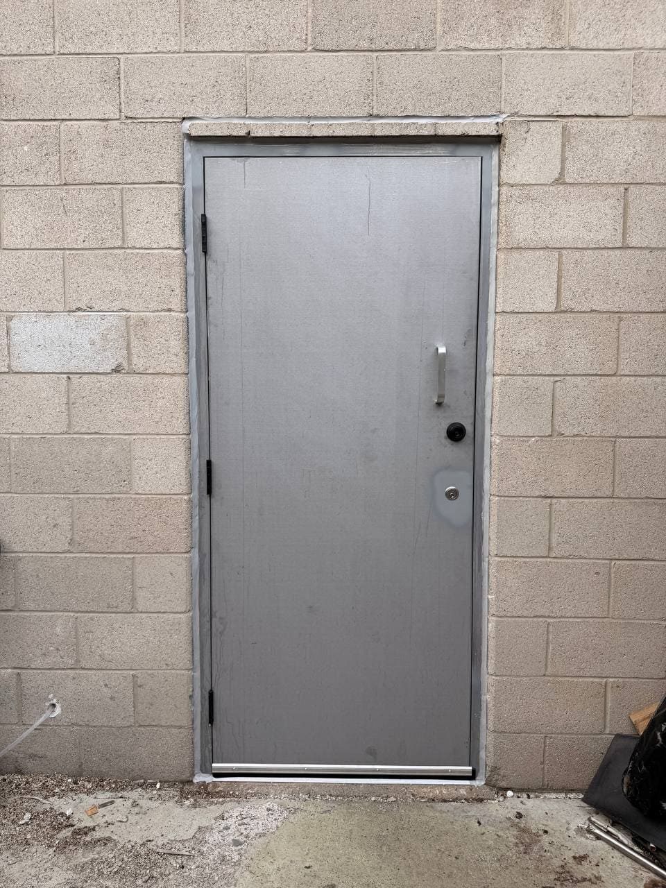 New metal rear service door installed in Pickering
