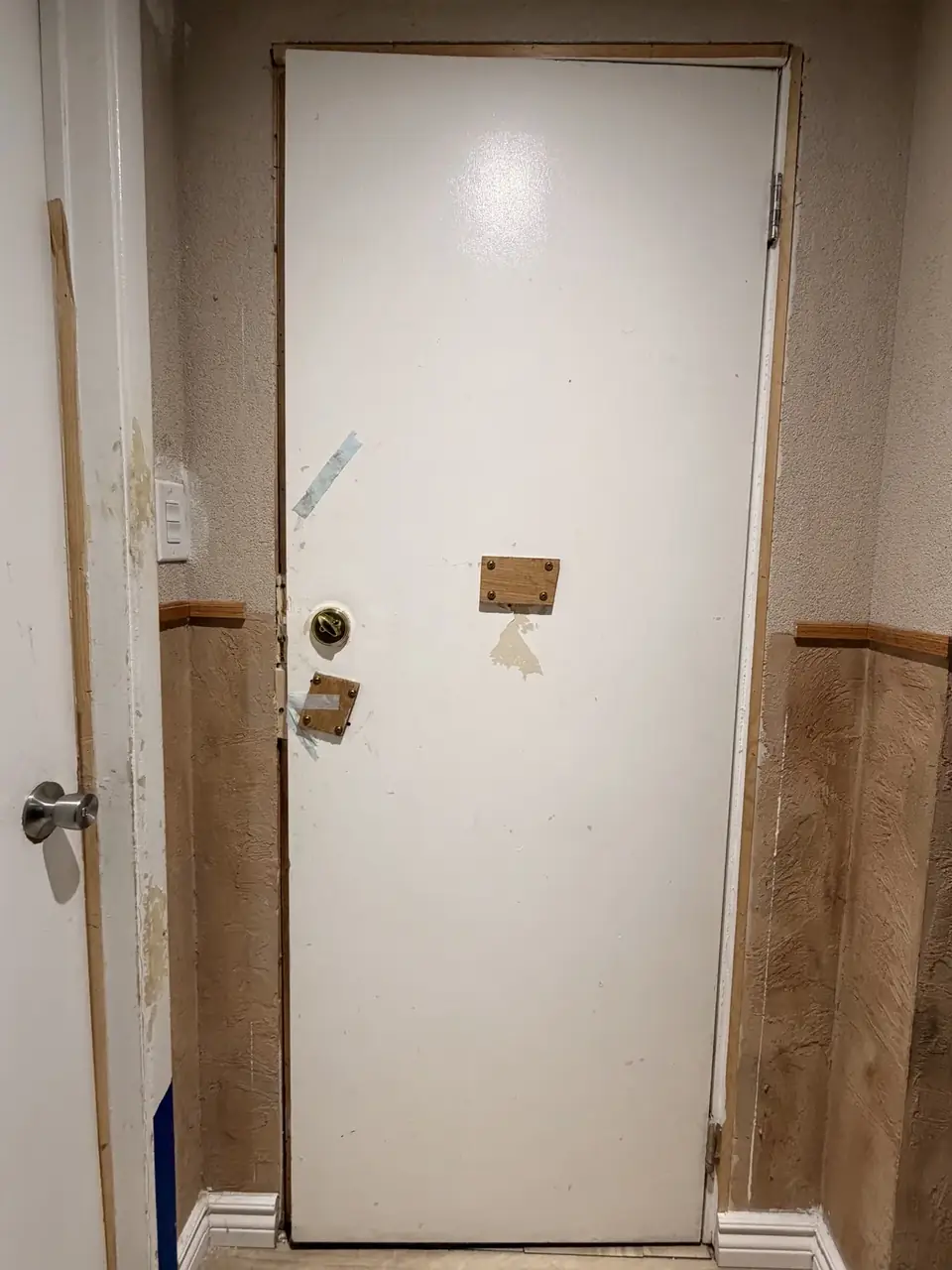 Existing interior door and frame in Mississauga before metal door-and-frame installation
