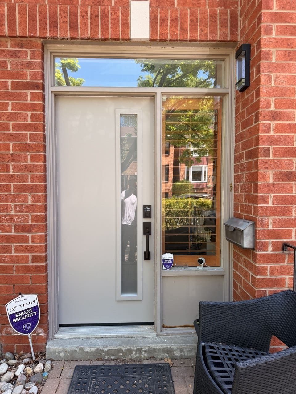 Modern front entry door installed in Newmarket with sidelight glass beside it
