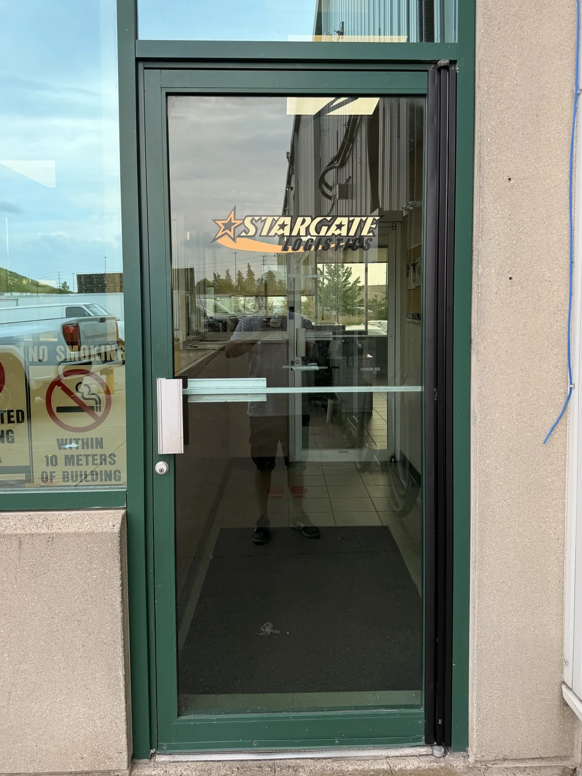 Second Mississauga aluminum entrance door after full-height continuous hinge installation